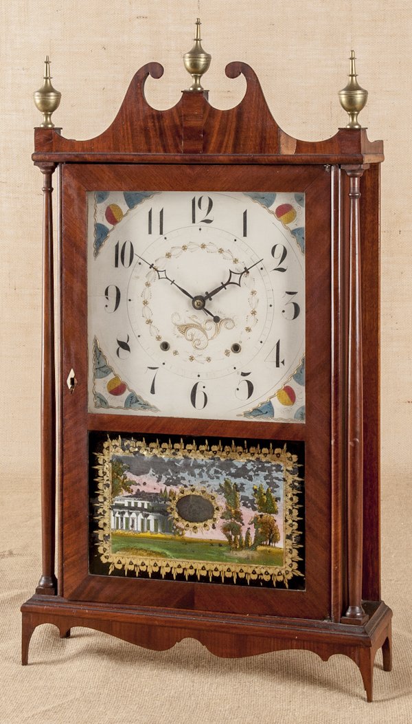 Eli Terry patent shelf clock made by Seth Thomas: Eli Terry patent shelf clock made by Seth Thomas, early 19th c., with full label and original brass finials, 20'' h., 17 1/2'' w.