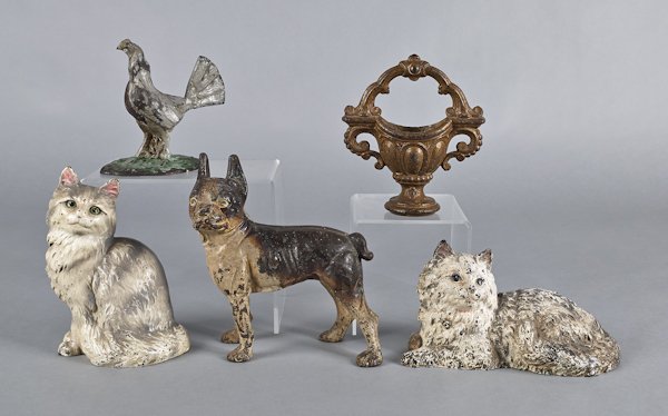 Five cast iron doorstops, to include a terrier, t: Five cast iron doorstops, to include a terrier, two cats, a basket, and a rooster, tallest - 9 1/2''.