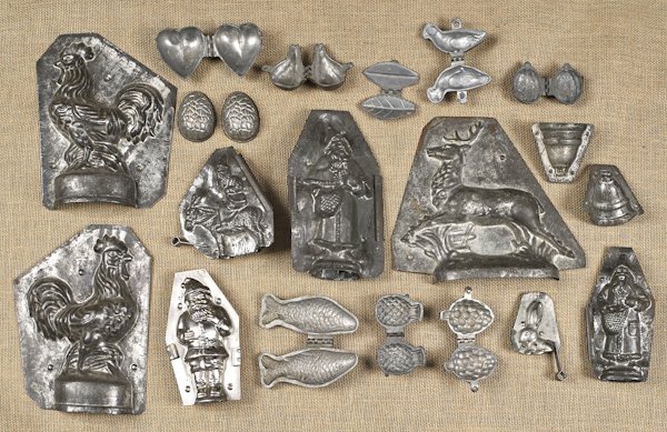 Group of tin and lead chocolate molds, to include: Group of tin and lead chocolate molds, to include Santas, a rooster, etc.
