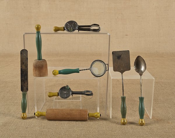 Eight piece child's kitchen set, early 20th c., w: Eight piece child's kitchen set, early 20th c., with yellow and green painted wood handles with facial features, rolling pin - 7 3/4'' l.