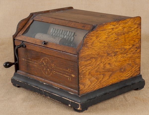 Concert Roller Organ, late 19th c., with an oak c: Concert Roller Organ, late 19th c., with an oak case and six rolls, case - 12 1/2'' h., 16 3/4'' w.