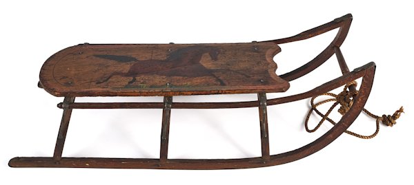 Painted pine child's sled, 19th c., decorated wit: Painted pine child's sled, 19th c., decorated with a running horse, 31'' l.