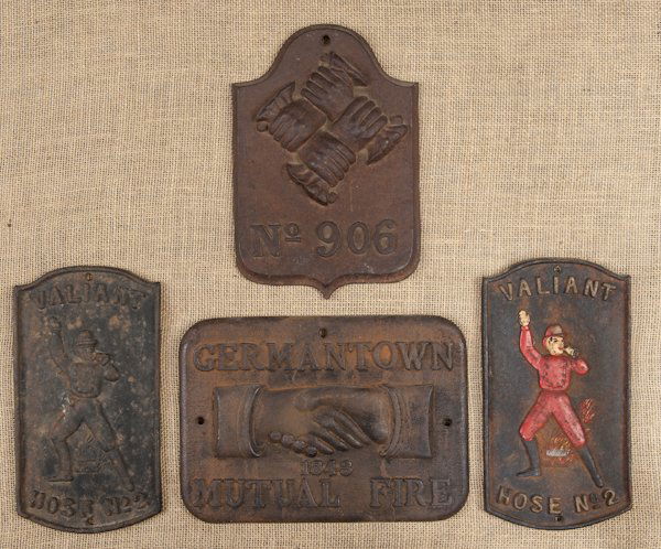 Four cast iron fire marks, to include Valiant,: Four cast iron fire marks, to include Valiant, Germantown Mutual Fire, etc., tallest - 10 1/2''.