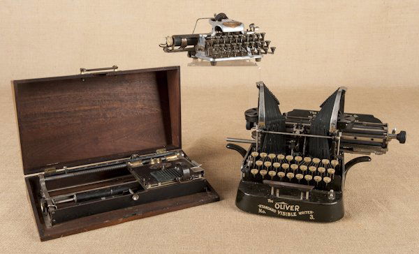 Hall typewriter, late 19th c., in a walnut case,: Hall typewriter, late 19th c., in a walnut case, 15 1/2'' w., together with a Blickensderfer no. 6 typewriter and an Oliver no. 3 typewriter.