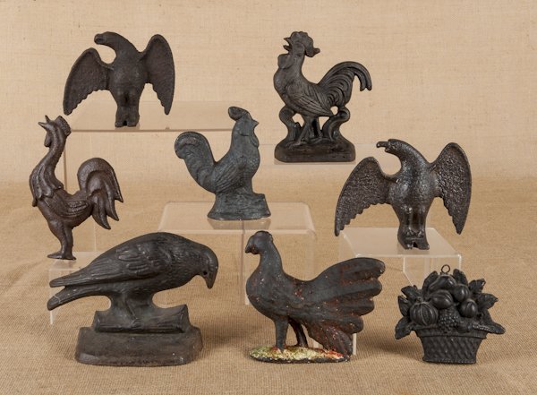 Group of cast iron, to include a crow doorstop, s: Group of cast iron, to include a crow doorstop, snow eagles, roosters, etc., tallest - 7 1/2''.