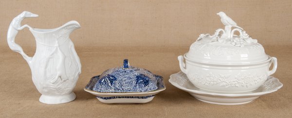 Mottahedeh ironstone covered tureen, with an unde: Mottahedeh ironstone covered tureen, with an undertray and a bird finial, 11'' h., together with a seaweed covered vegetable and a pitcher with a hound handle.