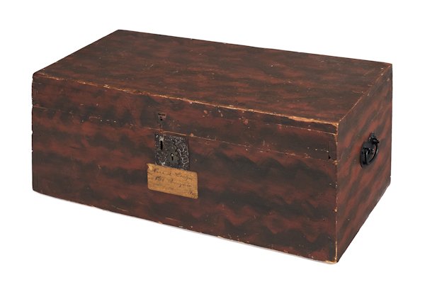 New England painted pine blanket box, 19th c., re: New England painted pine blanket box, 19th c., retaining its original red and black grained surface, 11'' h., 27 1/4'' w.