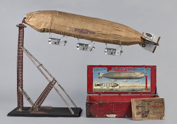A. C. Gilbert Erector set, early 20th c., No. 8,: A. C. Gilbert Erector set, early 20th c., No. 8, with a large cloth covered Zeppelin, original box, and booklet, 47'' l.