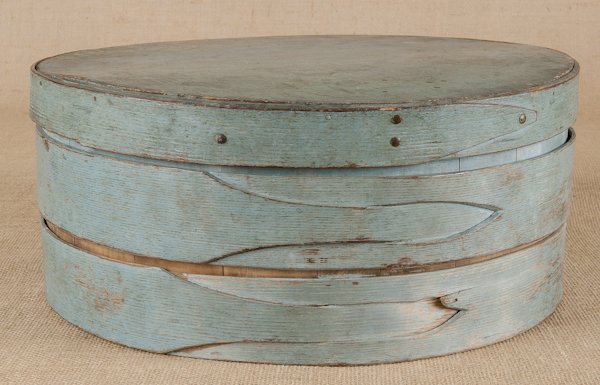 Painted bentwood pantry box, 19th c., retaining i: Painted bentwood pantry box, 19th c., retaining its original blue paint and finger lap joint, 7'' h., 17'' dia.