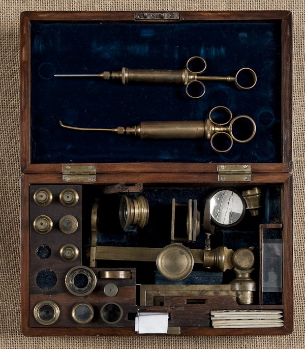 Cased rosewood microscope, ca. 1830, by JP Cutts: Cased rosewood microscope, ca. 1830, by JP Cutts & Sons, together with two brass syringes.