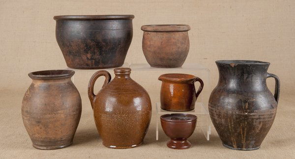 Seven pieces of American redware, 19th c., to inc: Seven pieces of American redware, 19th c., to include a sander, a crock, a jug, etc., tallest - 9 1/2''.