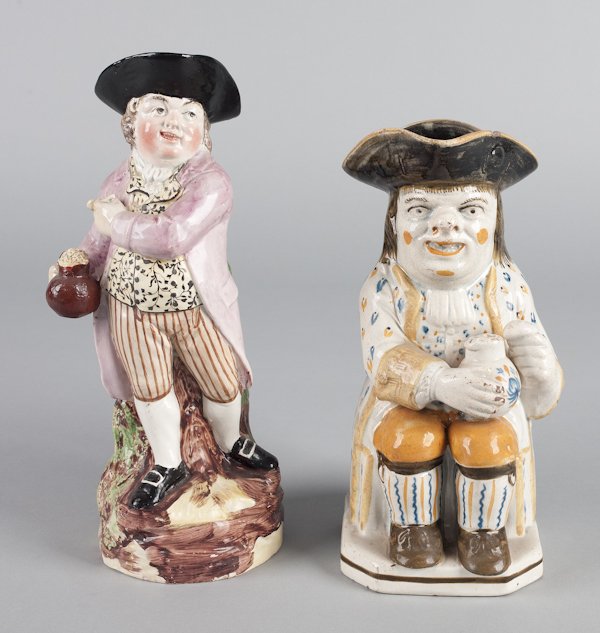 Two Staffordshire pearlware Toby jugs, 19th c.,: Two Staffordshire pearlware Toby jugs, 19th c., 10'' h. and 12'' h.