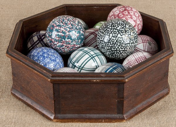 Collection of thirteen carpet balls, 19th c., t: Collection of thirteen carpet balls, 19th c., together with an octagonal walnut tray, 4 1/4'' h., 13 1/4'' l.