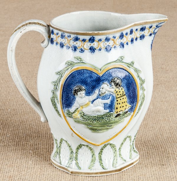 Prattware pearlware Mischievous Sport pitcher,: Prattware pearlware Mischievous Sport pitcher, 19th c., 7 1/2'' h.