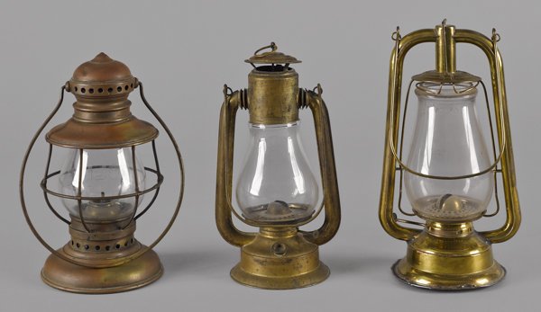 Three brass and tin carry lanterns, 19th c., one: Three brass and tin carry lanterns, 19th c., one with an etched Police globe, tallest - 11 1/2''.