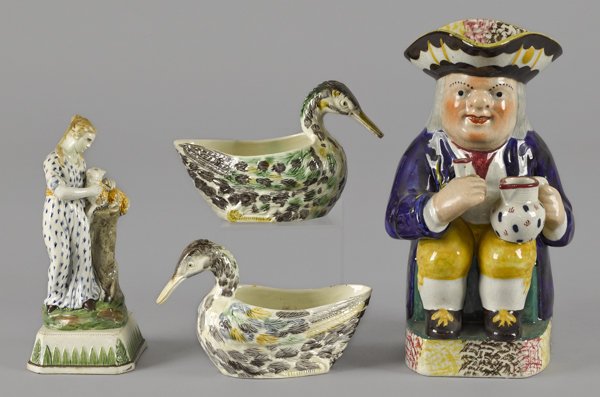 Staffordshire Toby pitcher, 19th c., together wit: Staffordshire Toby pitcher, 19th c., together with a pair of duck sauce boats and a pearlware figure, tallest - 9 3/4''.