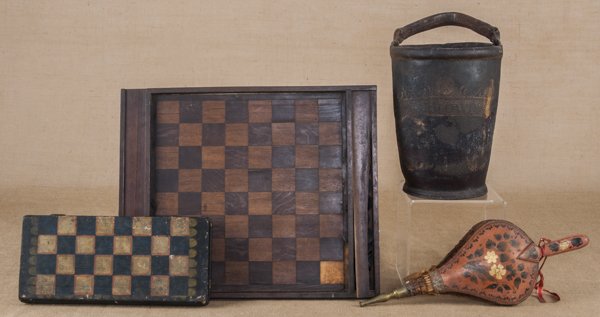 Painted leather fire bucket, 19th c., 12 1/2'' h.,: Painted leather fire bucket, 19th c., 12 1/2'' h., together with a painted checkerboard, a parquetry checkerboard, and bellows. Provenance: The Collection of Captain Hall Jackson Tibbits (1797-1872),
