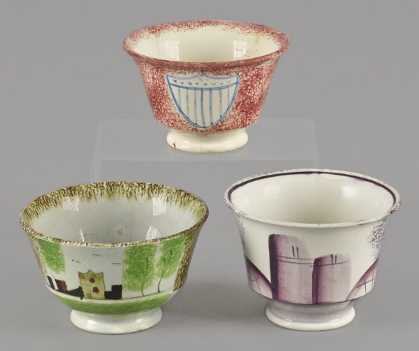 Three spatterware cups, in the shield, fort, and: Three spatterware cups, in the shield, fort, and wigwam pattern.