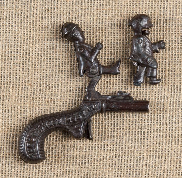 Ives cast iron Chinese Must Go animated cap gun: Ives cast iron Chinese Must Go animated cap gun, 4 1/2'' l.
