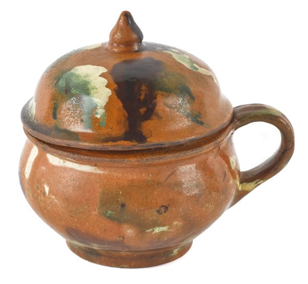 Pennsylvania redware sugar bowl with a cover, ea: Pennsylvania redware sugar bowl with a cover, early 19th c., with green, yellow, and black mottled glaze, 4'' h.