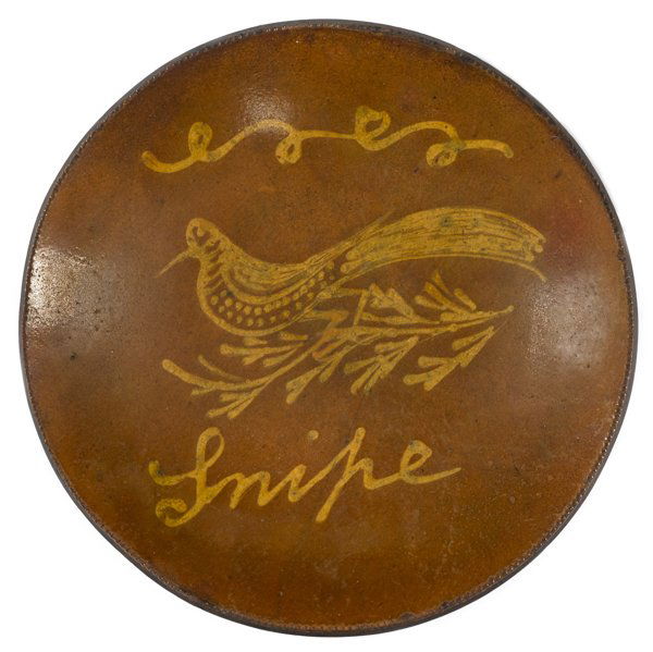 Matawan, New Jersey redware charger, 19th c., h: Matawan, New Jersey redware charger, 19th c., having a bird on a branch slip decoration, inscribed Snipe, 11 1/4'' dia.