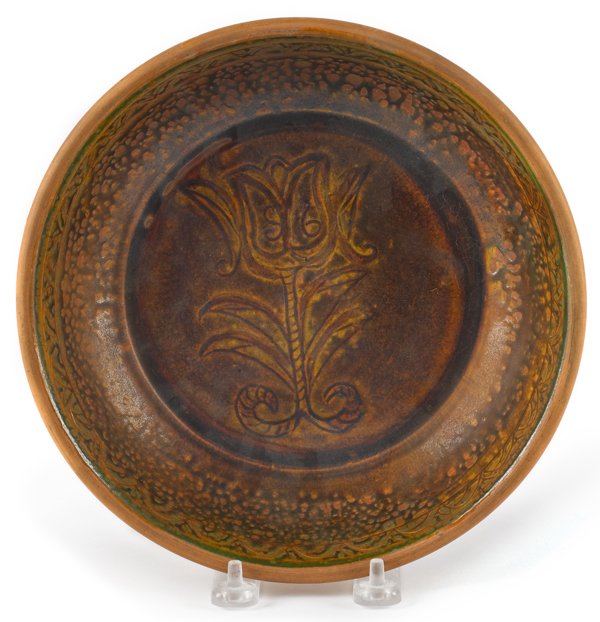 Pennsylvania redware shallow bowl, dated 1939: Pennsylvania redware shallow bowl, dated 1939, impressed I. S. Stahl, with an incised tulip, 2'' h., 8 3/4'' dia.