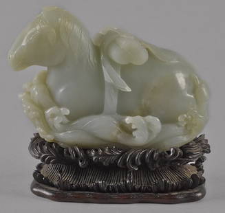 Chinese carved celadon jade recumbent horse, 3: Chinese carved celadon jade recumbent horse, 3 1/4'' h., 4 1/2'' w.