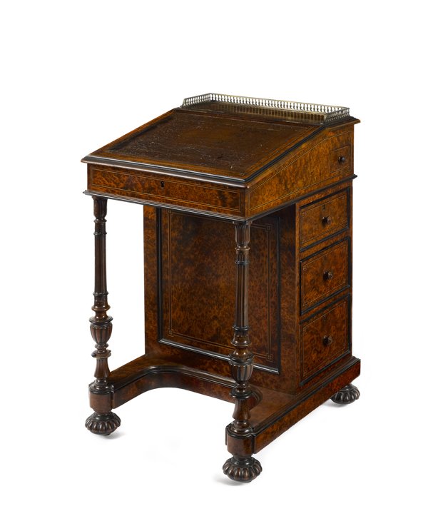 English burl veneer davenport desk by Gillow, ca: English burl veneer davenport desk by Gillow, ca. 1845, with a brass gallery and leather inset slant lid, over a case with inlaid drawers and turned and carved supports, stamped Gillow next to the loc