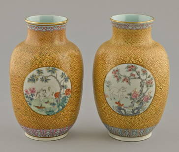 Pair of Chinese famille rose yellow ground porce: Pair of Chinese famille rose yellow ground porcelain vases with Qianlong mark, but probably Republic period, each with circular panels of a ram in a landscape, 8 1/4'' h.