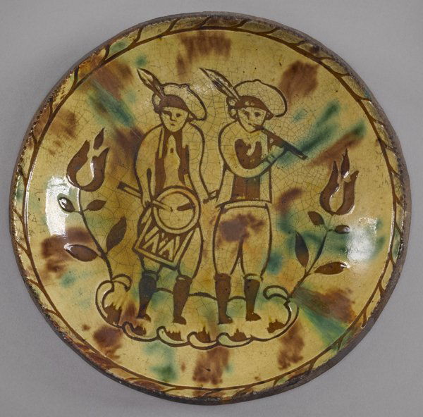Jacob Medinger (Montgomery County, Pennsylvania: Jacob Medinger (Montgomery County, Pennsylvania 1856-1932) redware plate, with sgraffito decoration of boys with a fife and drum, 8 3/4'' dia.