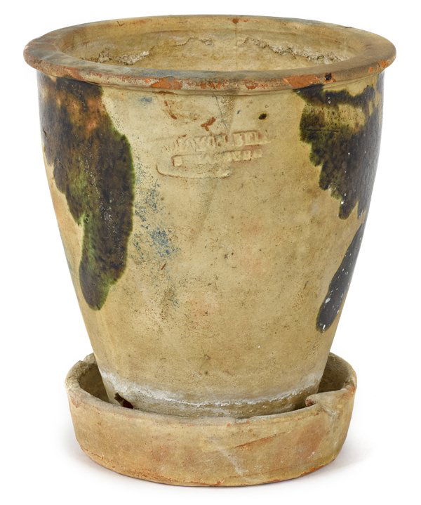 Virginia redware flowerpot and undertray, 19th c: Virginia redware flowerpot and undertray, 19th c., impressed Solomon Bell Strausburg Va., with manganese splotching, 6 1/4'' h., 5 5/8'' dia.