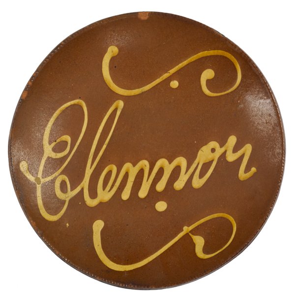 New England redware plate, 19th c., with slip i: New England redware plate, 19th c., with slip inscription Elennor, 11'' dia.