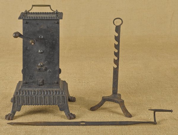 Iron clockwork spit, early 19th c., with animal: Iron clockwork spit, early 19th c., with animal paw feet, a spit rod, and a stand, 15'' h.