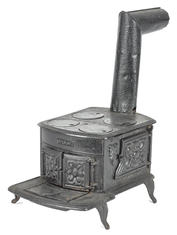 Orr, Painter & Co. cast iron Lilly toy stove, 7: Orr, Painter & Co. cast iron Lilly toy stove, 7'' h., 8'' w.