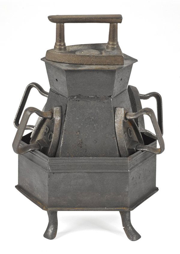 Tin sad iron heater, together with five cast iron: Tin sad iron heater, together with five cast iron sad irons, 6 3/4'' h.