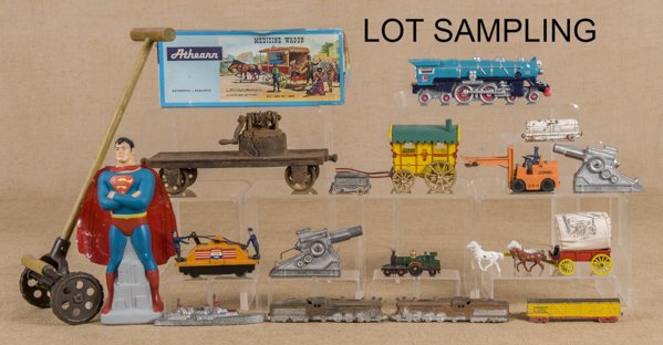 Group of miscellaneous toys, to include an Arcade: Group of miscellaneous toys, to include an Arcade cast iron rotary mower, a Texan cap gun, slush vehicles and trains, a horse drawn gypsy wagon with the original box, a plastic Evinrude boat motor pin