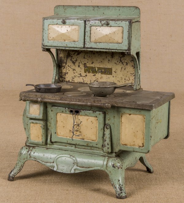 Vindex cast iron, nickel, and tin Admiral toy s: Vindex cast iron, nickel, and tin Admiral toy stove, 15 1/4'' h., 13'' w., together with a frying pan and a pot.