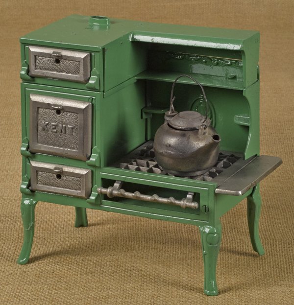 Kenton cast iron Kent toy gas stove with a stee: Kenton cast iron Kent toy gas stove with a steel tea kettle, 9 1/2'' h., 9 3/4'' w.