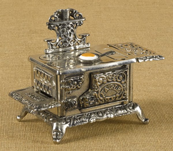 Hubley Cast iron and nickel Eagle toy stove, 7: Hubley Cast iron and nickel Eagle toy stove, 7 1/2'' h., 9 3/4'' w.