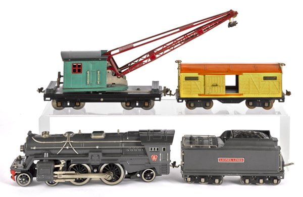 Lionel standard gauge four-piece train set, to in: Lionel standard gauge four-piece train set, to include a #392E Engine, a Tender, a #514 Boxcar, and a #219 Derrick.
