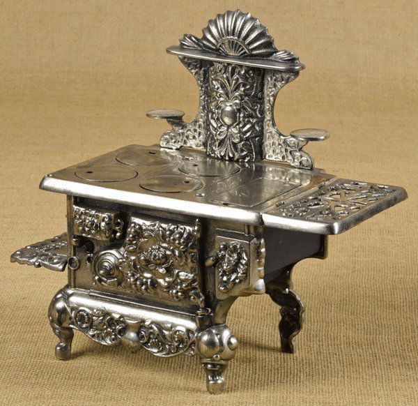 Ideal cast iron and nickel Sterling toy stove,: Ideal cast iron and nickel Sterling toy stove, 12 1/4'' h., 13 1/2'' w.