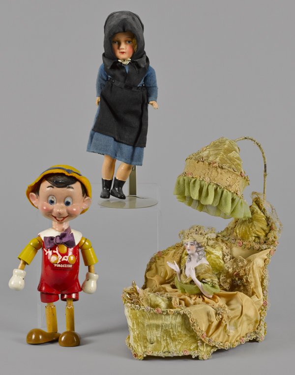 Ideal Disney jointed Pinocchio doll, 10 1/2'' h.,: Ideal Disney jointed Pinocchio doll, 10 1/2'' h., together with a composition doll in an Amish dress, 11 1/2'' h., and a bisque doll boudoir lamp, 13'' h.