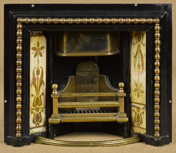 A. Bagnall iron, brass, and tin salesman sample f: A. Bagnall iron, brass, and tin salesman sample fireplace insert with a mantel, 9 3/4'' h., 11 1/2'' w.