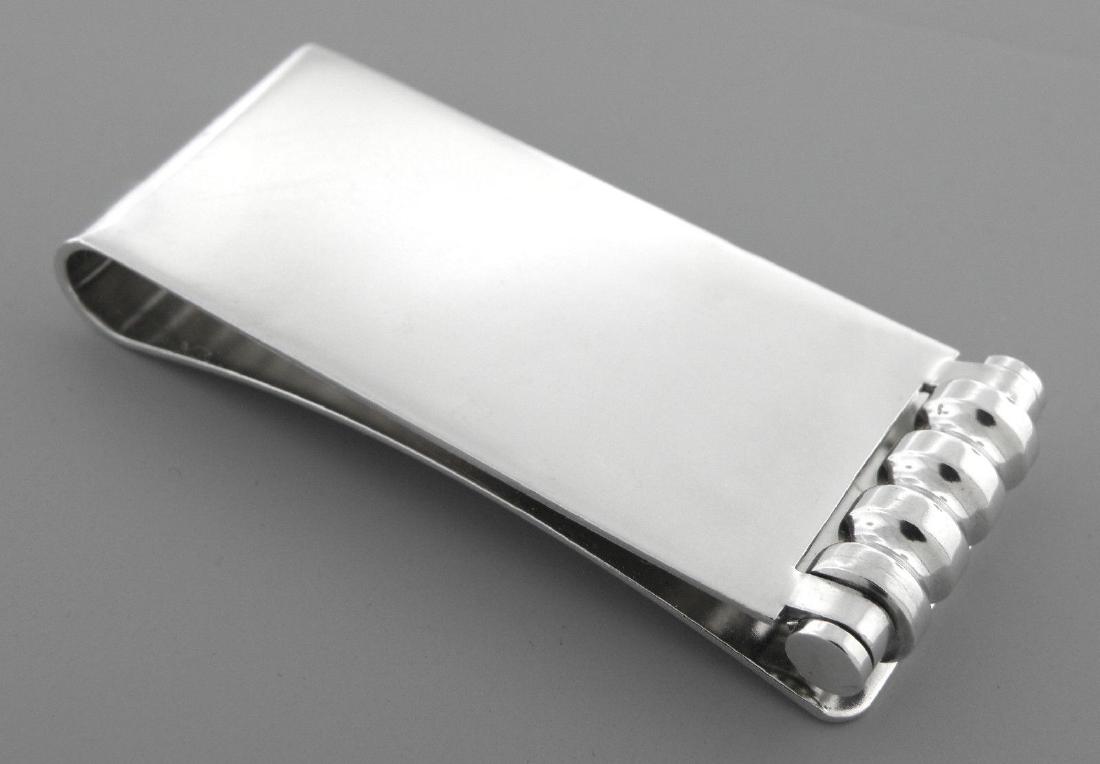 TIFFANY & Co. STERLING SILVER PALOMA PICASSO MONEY CLIP: TIFFANY & Co. STERLING SILVER PALOMA PICASSO MONEY CLIP Clip measures 2.38" L x 0.98" W Sterling silver paloma picasso groove money clip, has roller so its smooth to put in and take out items Pre-owne