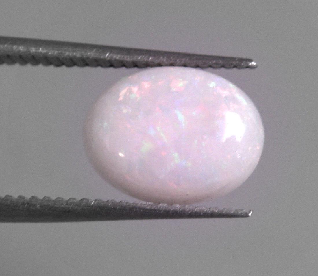 1.26ct NATURAL WHITE MULTI COLORED OPAL OVAL 9x7mm (1 of 2)