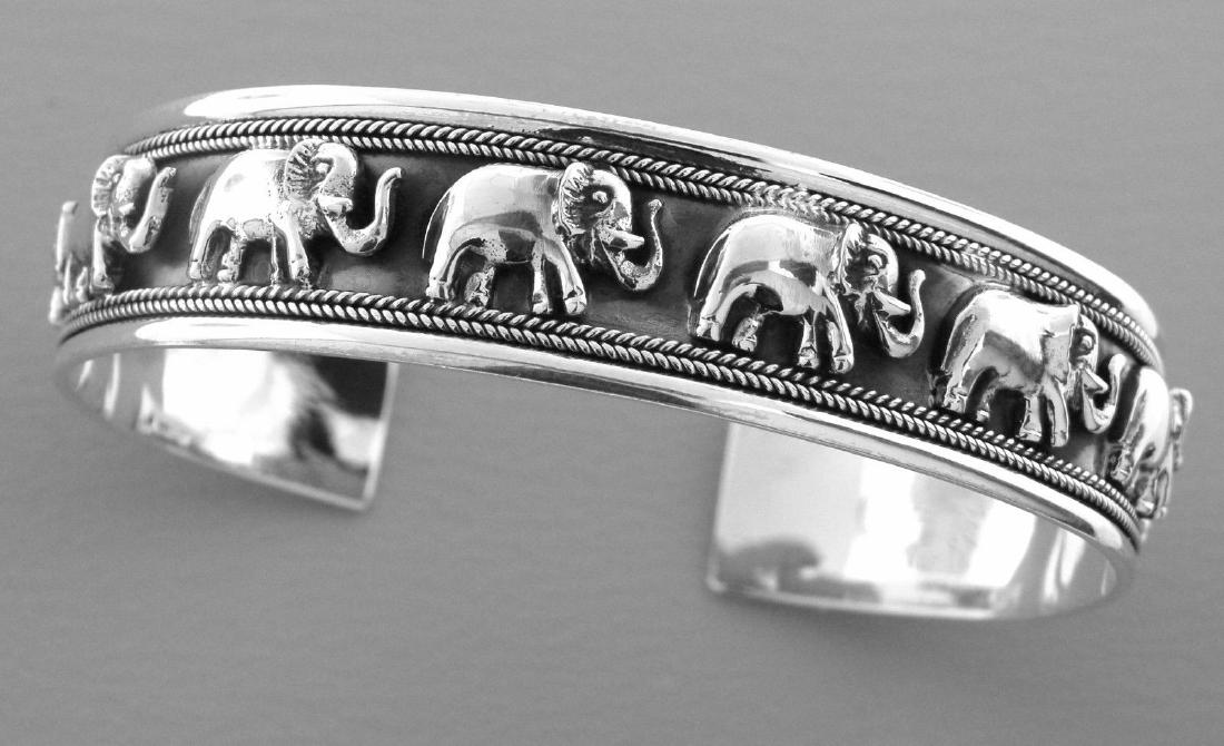 NEW STERLING SILVER ELEPHANT ROPE CUFF UNISEX BANGLE: NEW STERLING SILVER UNISEX CUFF BANGLEBangle measures 7.75" Long (will fit upto 7.75" wrist)Bangle measure 15.1mm WideSterling silverNewStamped 925Total weight 30 grams