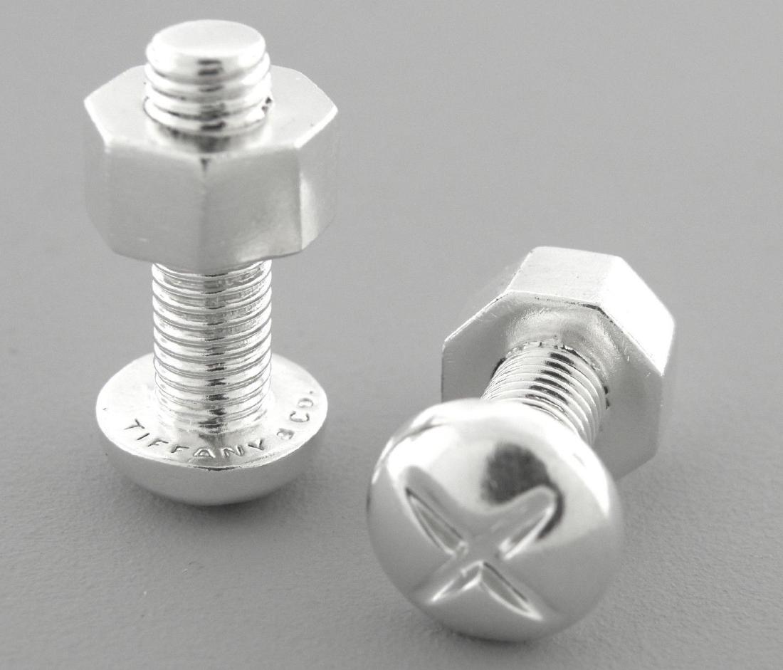 TIFFANY & Co. STERLING SILVER NUT & BOLT CUFFLINKS: TIFFANY & CO STERLING SILVER CUFFLINKSMeasures 0.47" in diameter, Length measures 0.96" Sterling silver nut and bolt cufflinksPre-owned in excellent condition, please refer to picsStamped TIFFANY & CO