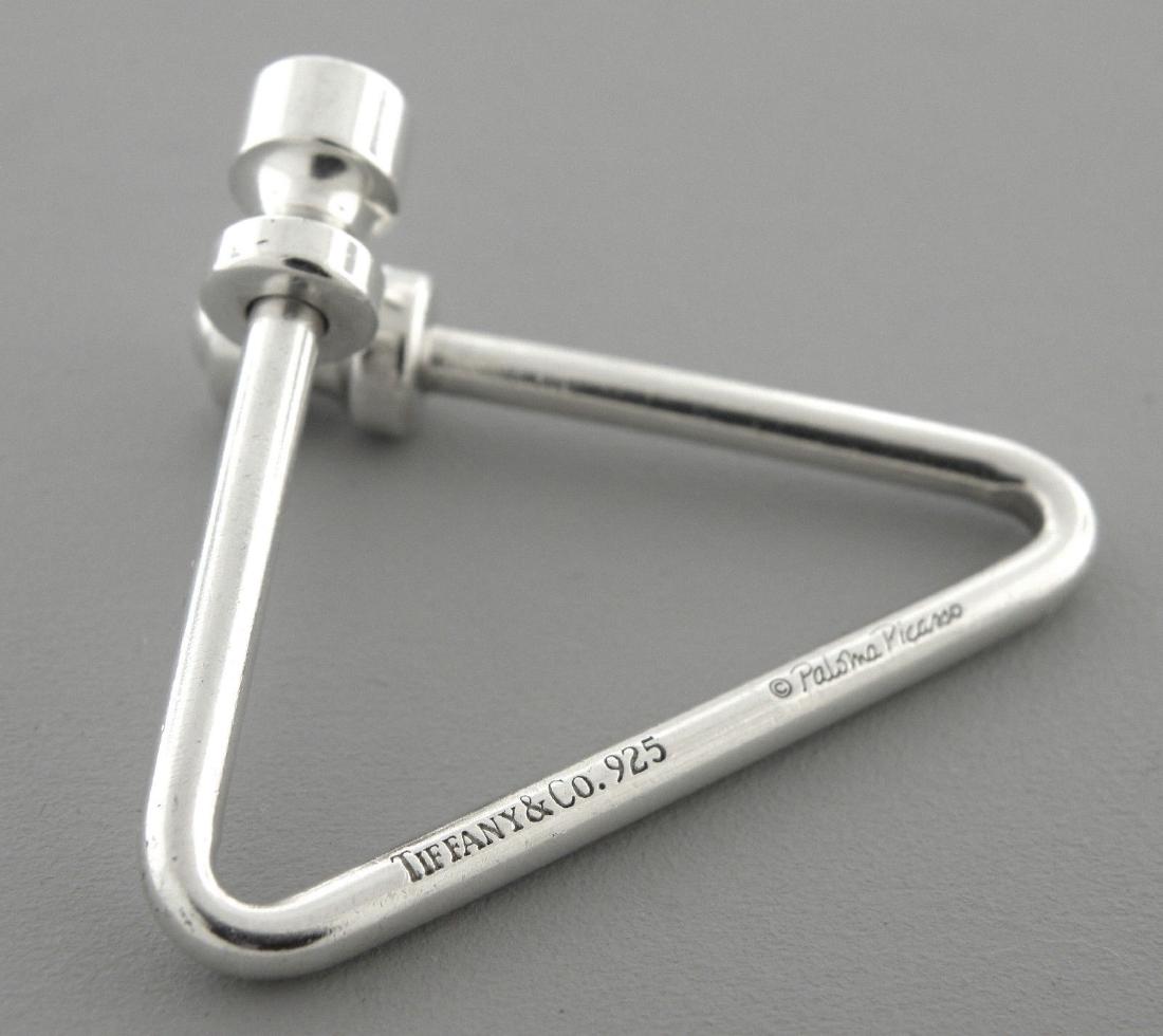 TIFFANY & Co. STERLING SILVER PICASSO TRIANGLE KEYRING: TIFFANY & Co. STERLING SILVER KEYRINGKeyring measures 1.54" H x 1.90" WSterling silver Paloma picasso Triangle Keyring Pre-owned in good condition, minor wear due to age please refer to picsStamped TI