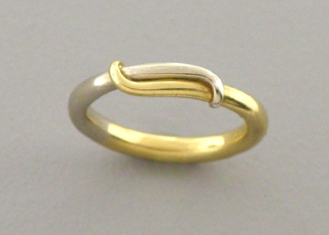 AUTHENTIC CARTIER 18K TWO TONE GOLD OVERLAP RING: CARTIER 18K GOLD WEDDING BANDS RING SIZE 5.5Rings size is a 5.5Ring measure 3.8mm wide on topCartier 18K white and yellow gold overlap ringPre-owned, Ring is in good condition, please refer to picsSta