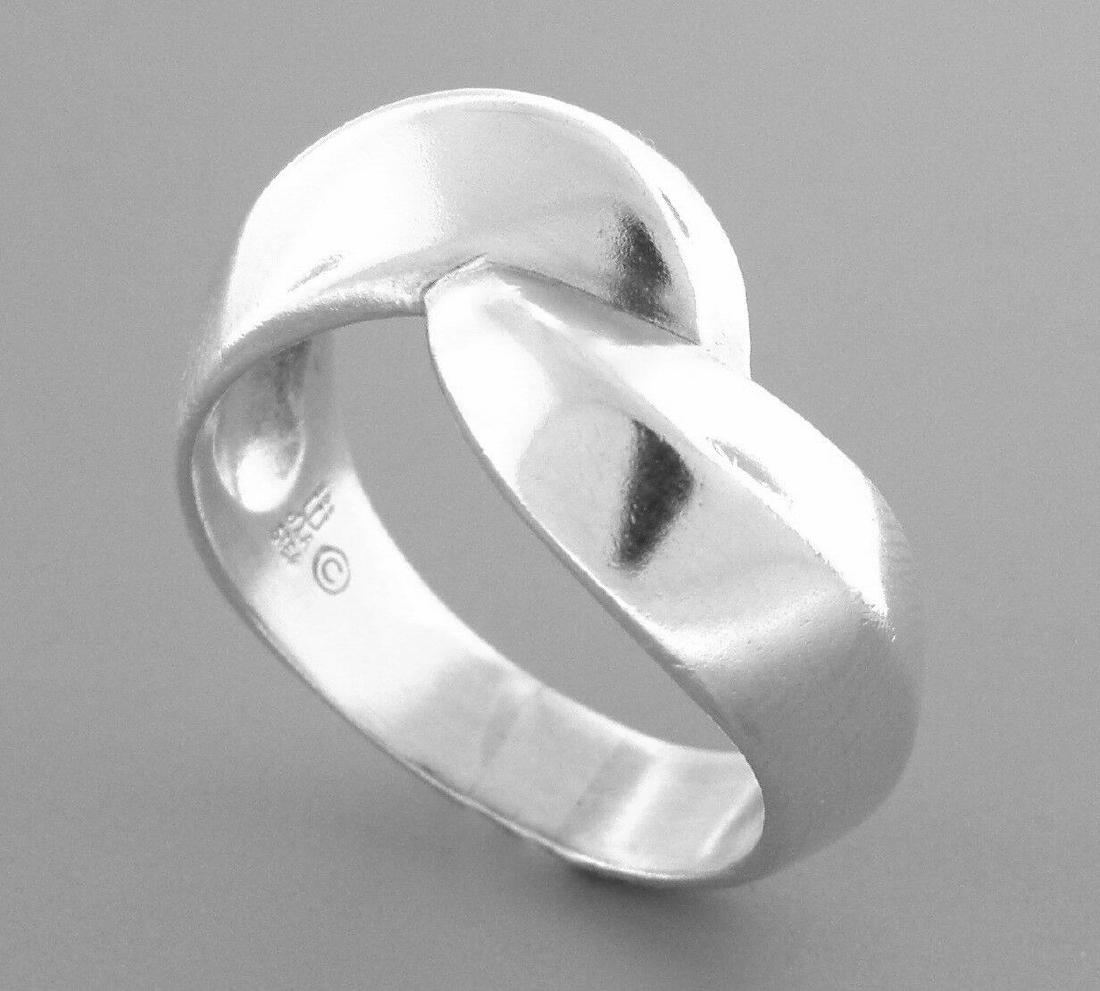 JAMES AVERY STERLING SILVER BYPASS CROSSOVER RING SIZE: JAMES AVERY STERLING SILVER RINGSize 9Measures 0.49" wide in frontJames Avery Sterling silver bypass ring Vintage, Pre-owned, in good condition, minor wear due to age, please refer to picsStamped JA S